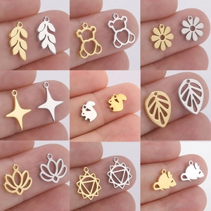 Macro detail of various gold and silver stainless steel charms for DIY jewelry making