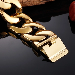 Macro shot of large square buckle on gold cuban link bracelet for men with mirror finish
