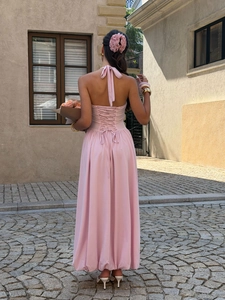 Pink halter backless maxi dress with corset lacing and elegant long silhouette