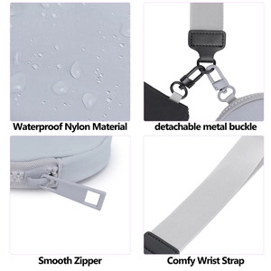 Detail of waterproof nylon wrist bag showing smooth zippers and detachable metal clips