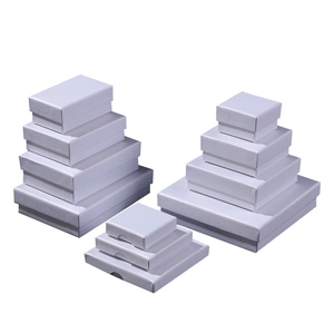 White linen textured jewelry gift boxes in various square and rectangular sizes