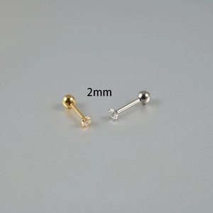 Close-up of 2mm zircon stud earring with ball screw back in gold and silver finish
