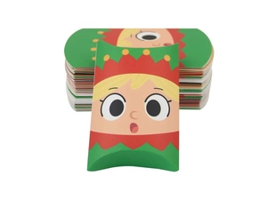Close-up of Christmas pillow candy box with festive elf design and flat-packed sheets