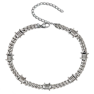 Silver thorn Cuban chain bracelet with barbed wire links and lobster clasp on white background