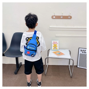 Rear view of a child wearing a blue cartoon school bus crossbody bag with print details