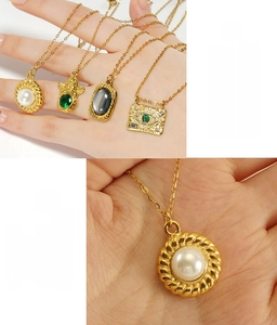 Close-up of 18K gold-plated stainless steel necklaces with natural stone pendants