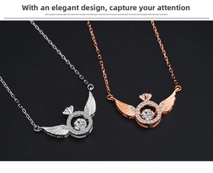 Close-up of angel wing necklace pendants in silver and rose gold with dancing zircon stones