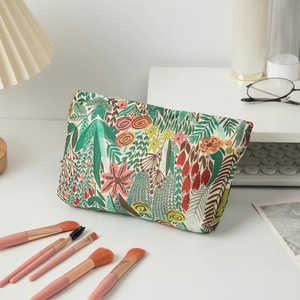 Detail of floral embroidery on high-capacity makeup bag with a sturdy metal zipper
