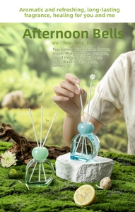 Detailed aromatic reed diffuser set in mossy natural scene with glass bottle and fiber sticks