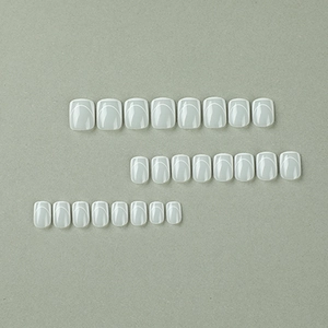 Minimalist white French press-on nails set featuring clean curved line designs