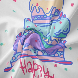 Detail of bohemian tapestry featuring colorful cartoon cake prints and soft fabric texture