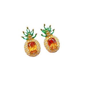 Creative pineapple-shaped earrings with vibrant orange stones and green gemstone leaves