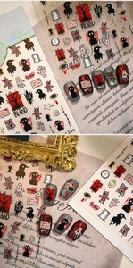 Gros plan sur stickers ongles gothiques Halloween avec corbeaux, yeux et motifs d'arbres