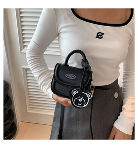 Mini black saddle bag with bear charm detail and Hello Hello logo on the front