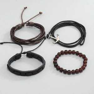 Men's retro layered bracelet set featuring nautical anchor pendant and woven leather straps