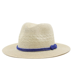 Classic beige Panama straw hat with a wide brim and decorative navy blue rope band
