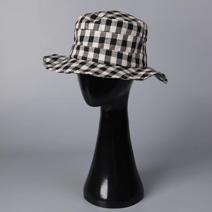 Detailed texture of black and white checkerboard pattern on casual linen bucket hat