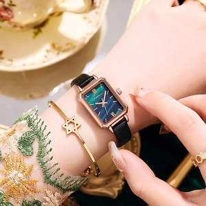 Detail of vintage square quartz watch with emerald marble dial and black leather strap