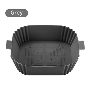 Grey square silicone air fryer liner with oil-guiding grooves and heat-resistant handles