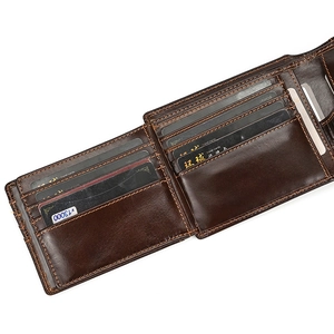 Macro view of genuine leather wallet showing multiple card slots and orange stitching details