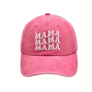 Detailed close-up of pink washed cotton fabric with white MAMA embroidery on baseball cap