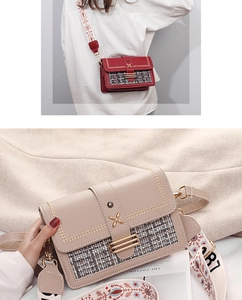 Detail of tweed crossbody bag featuring V-shaped stitching and floral embroidered strap