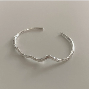Minimalist 925 sterling silver open bangle with irregular twisted mobius design