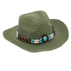 Detail of army green straw cowboy hat with ethnic beads and large turquoise gemstone