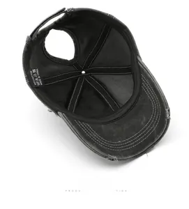 Detail view of cotton baseball cap interior featuring ponytail hole and quality stitching