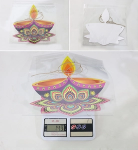 Detail of Diwali Diya door sign with mandala pattern showing front back and weight