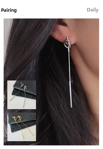 Detail of 18k gold plated knot tassel drop earrings in silver and gold finishes