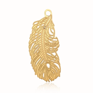Detailed view of a gold feather pendant with intricate filigree and cut-out metalwork