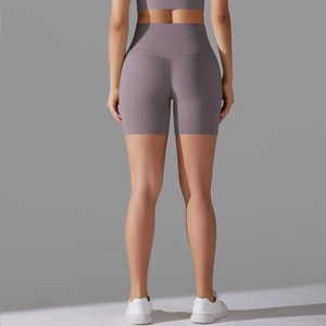 Rear view of high-waisted lilac yoga shorts featuring a seamless bum lifting design