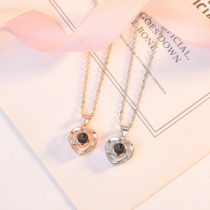 Projection heart necklace in rose gold and silver finishes with crystal accents