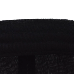 Close-up view of the inner stitching and sweatband of a black sequin baseball cap.
