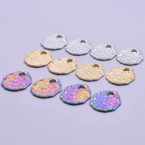 Textured oval titanium steel pendants in silver, gold, and iridescent finishes