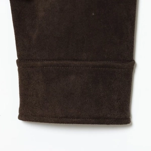 Veste en velours marron foncé avec coutures détaillées à double aiguille aux poignets
