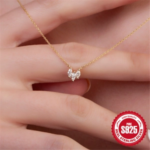 Elegant 925 sterling silver gold necklace with three marquise cut crystals on a model