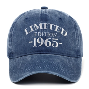 Close-up of white 1965 Limited Edition embroidery on washed blue denim baseball cap