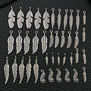Detailed set of 32 silver vintage alloy feather pendants for DIY jewelry making