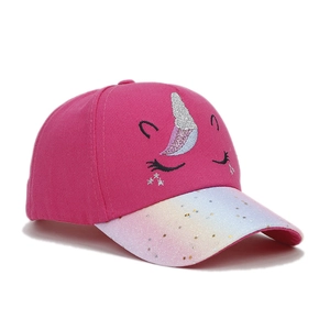 Detail of cute unicorn kids baseball cap with 3D silver horn and glittery visor