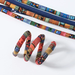 Detail of colorful patchwork spiral hair ties and straight fabric hair wraps for locs