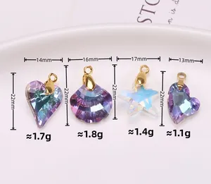 Macro detail of aurora crystal heart, shell, and star pendants for DIY jewelry making