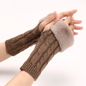 Macro view of cable knit pattern and soft faux fur trim on coffee brown fingerless gloves