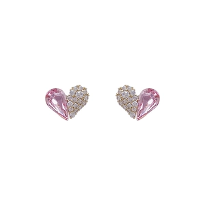 Pink heart crystal stud earrings with gold plating and paved rhinestones on white background