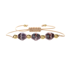 Handmade woven bracelet with purple ceramic diamond beads and gold metallic spheres
