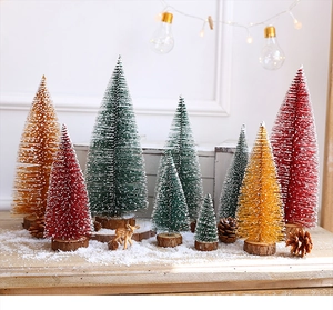 Miniature sisal Christmas trees with artificial snow flocking on solid wood bases