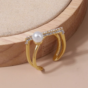 Elegant gold open ring featuring a central round pearl and pavé zirconia on double bands