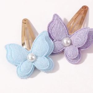 Set of two glitter butterfly hair clips with pearls in blue and purple colors