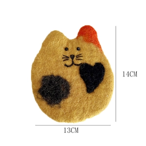 Detail view of handmade wool felt cat coaster showing dimensions of 14cm by 13cm